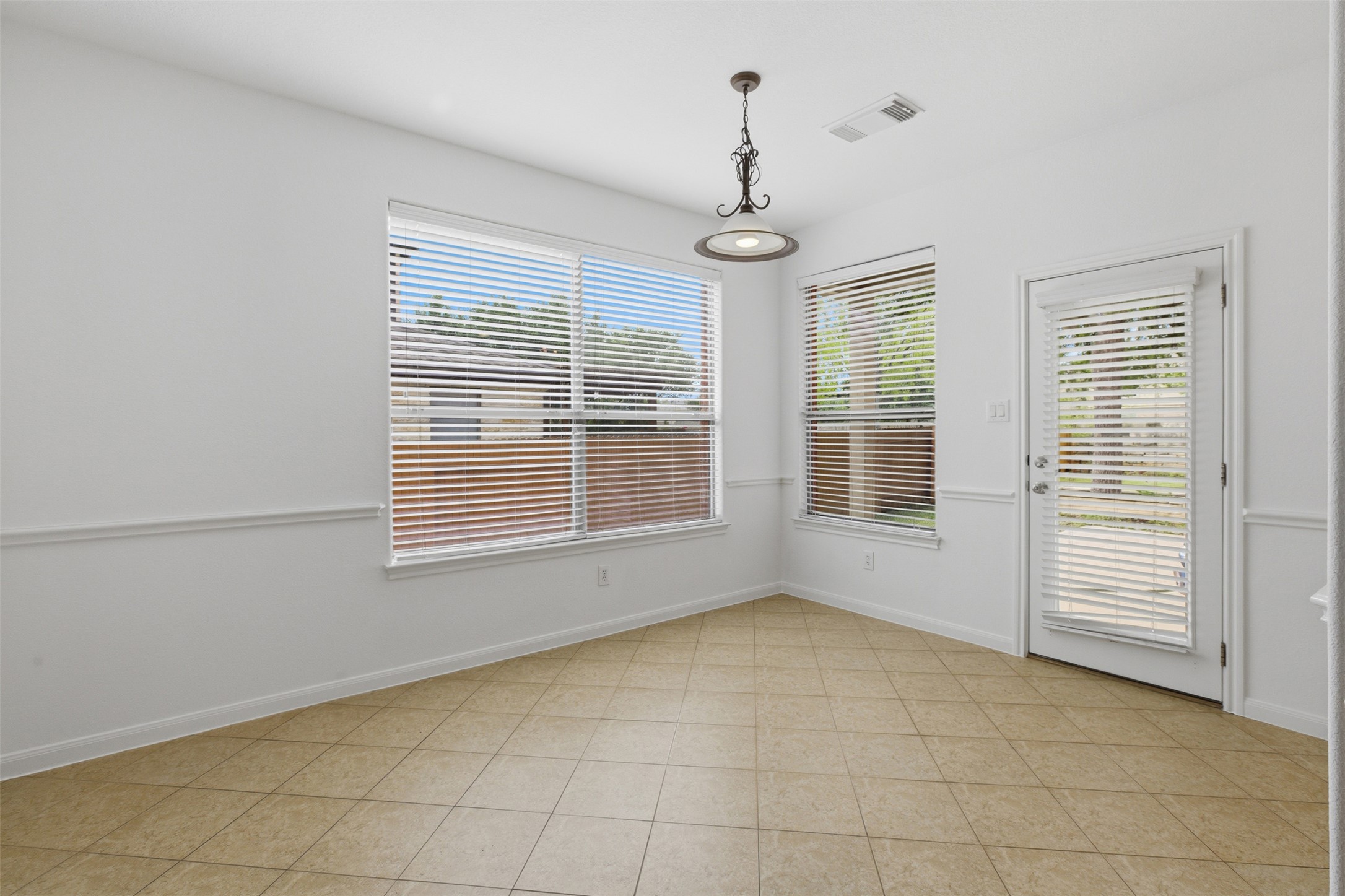 2909 Agave Loop Round Rock, TX 78681 - Photo 13 of 38 Breakfast area leading to Backyard