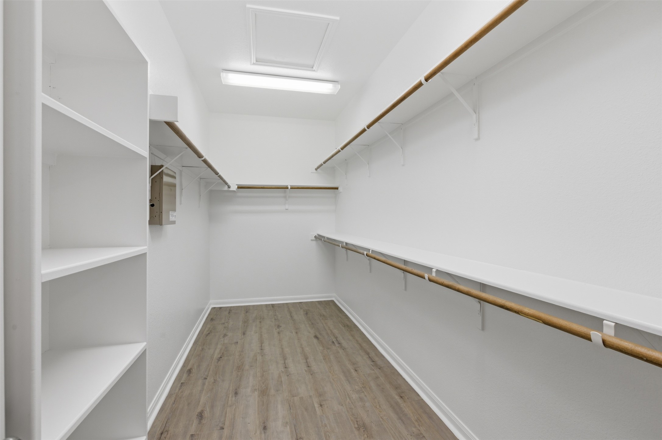 2909 Agave Loop Round Rock, TX 78681 - Photo 18 of 38 Master Walk in closet featuring attic access and light wood-style floors