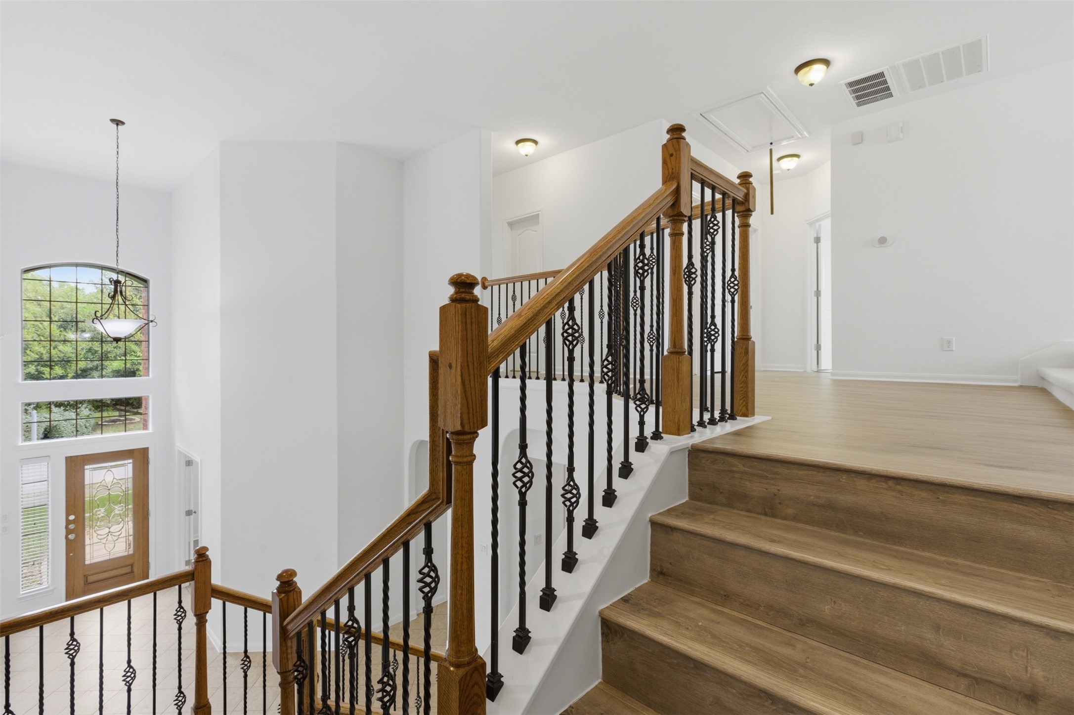 2909 Agave Loop Round Rock, TX 78681 - Photo 19 of 38 Stairway featuring attic access and wood finished floors
