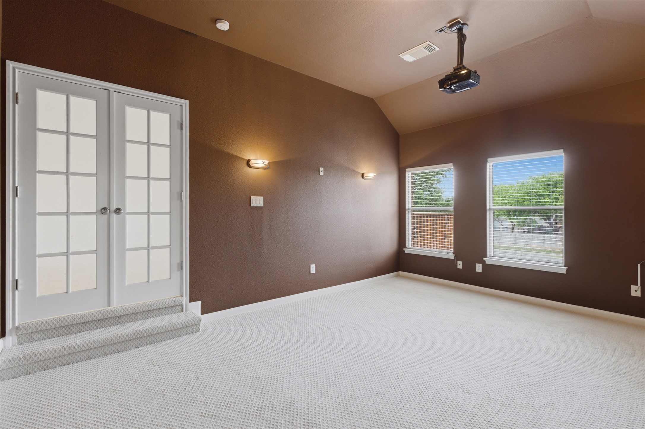2909 Agave Loop Round Rock, TX 78681 - Photo 23 of 38 Carpeted empty room with vaulted ceiling and baseboards