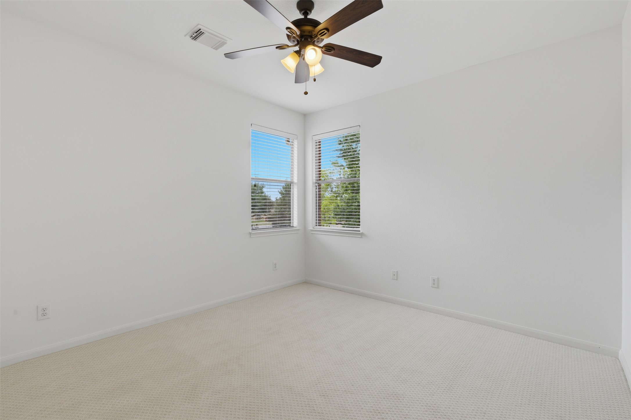 2909 Agave Loop Round Rock, TX 78681 - Photo 26 of 38 Bedroom 3 featuring carpet connected bathroom, and a ceiling fan