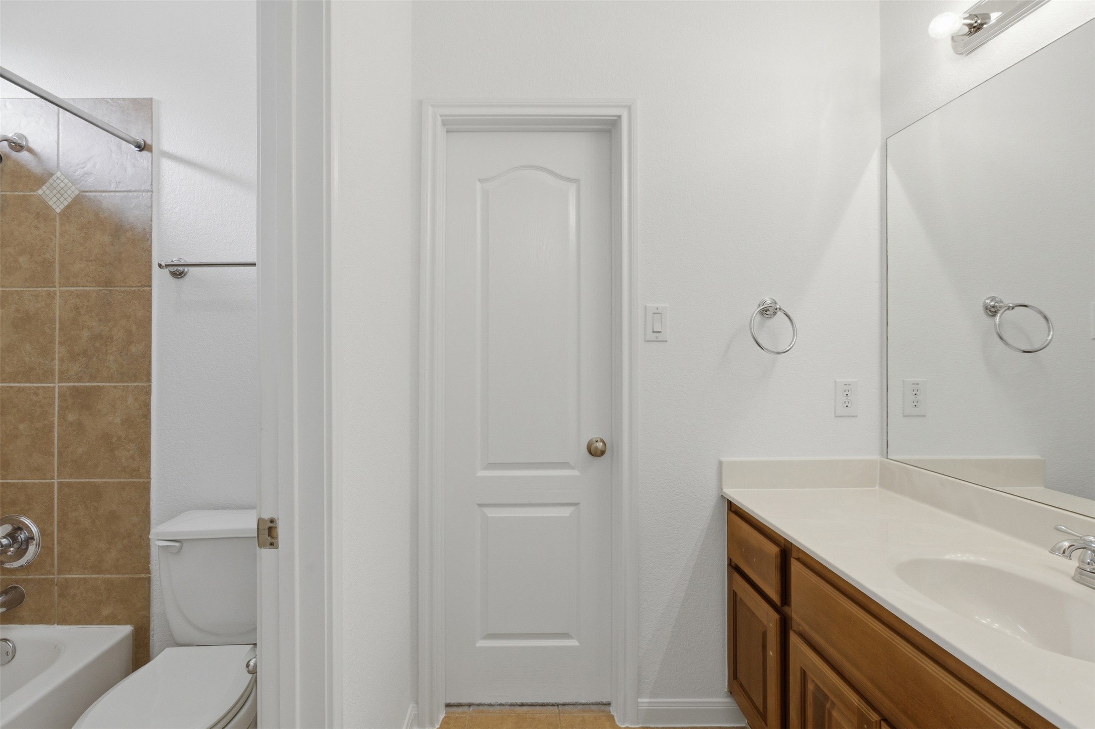 2909 Agave Loop Round Rock, TX 78681 - Photo 28 of 38 Full bathroom 3 with vanity, washtub / shower combination, and light tile patterned floors