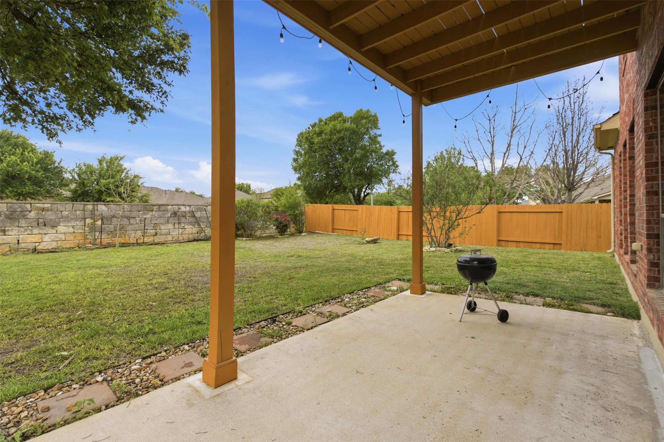 2909 Agave Loop Round Rock, TX 78681 - Photo 32 of 38 Stone Back & Sides Fenced backyard with a patio area and a grill