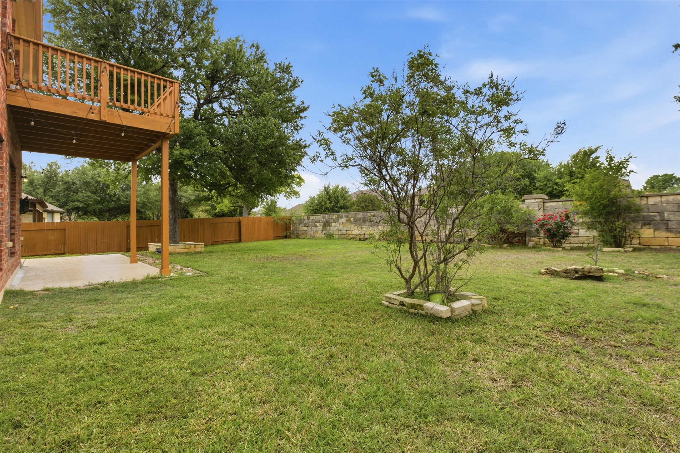 2909 Agave Loop Round Rock, TX 78681 - Photo 33 of 38 Fenced backyard featuring a patio area and a wooden deck