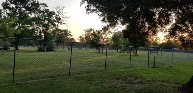 a balcony with trees in front of it