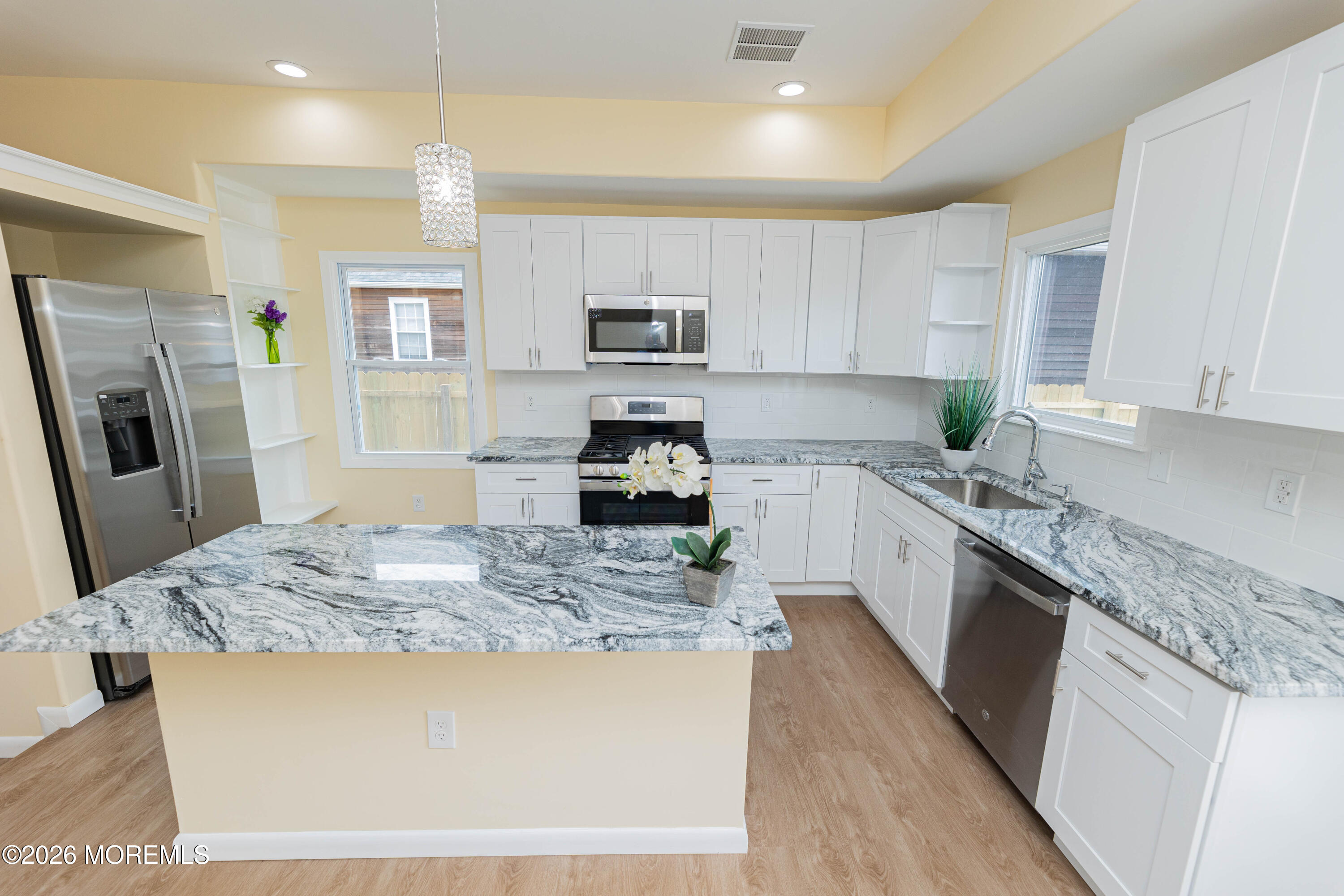 2408 Herbertsville Road Point Pleasant, NJ 08742 - Photo 1 of 82 a kitchen with stainless steel appliances granite countertop a sink stove microwave and refrigerator