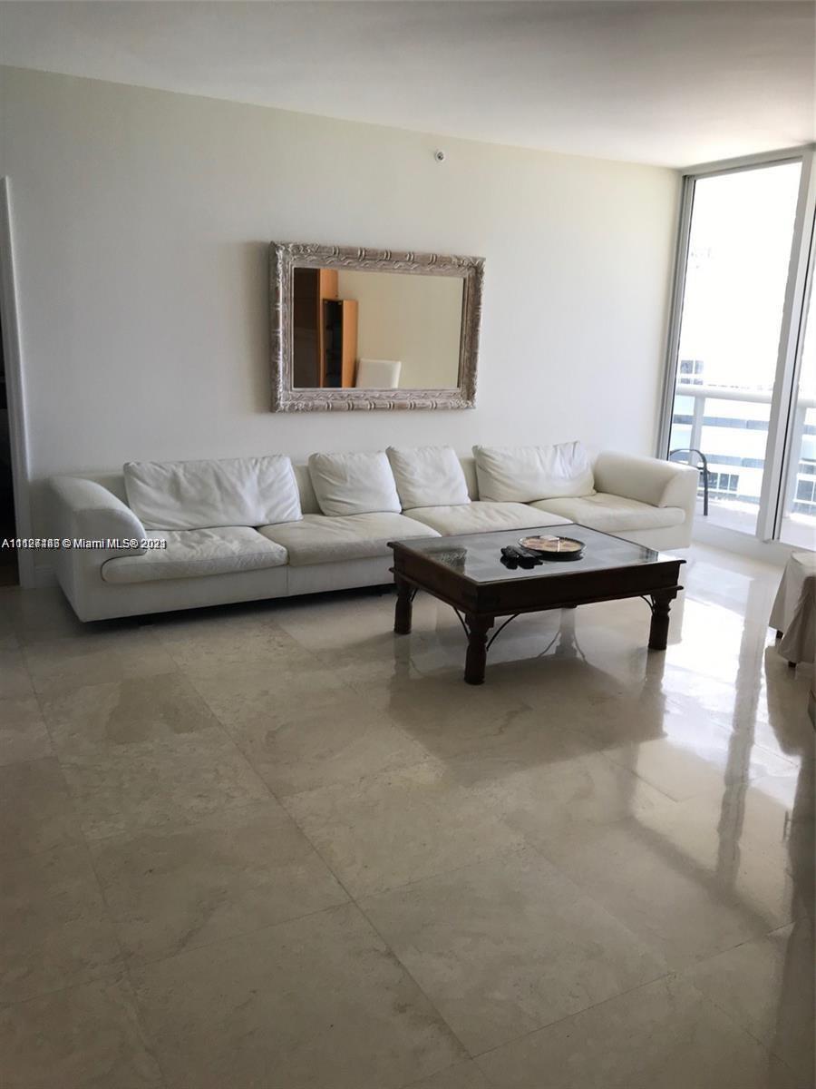 9595 Collins Avenue, Unit N9I Surfside, FL 33154 - Photo 4 of 6 a living room with furniture and a large window