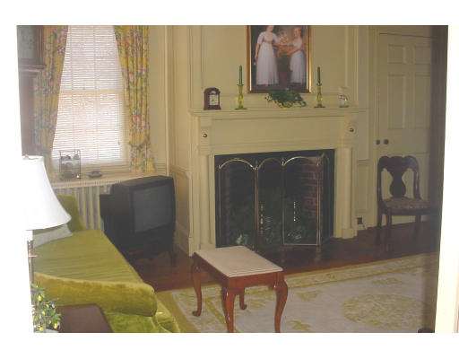 80 First Parish Road Scituate, MA 02066 - Photo 7 of 14 a living room with furniture and a fireplace