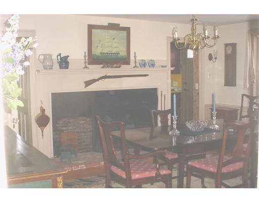 80 First Parish Road Scituate, MA 02066 - Photo 9 of 14 a dining room with chandelier and wooden floor