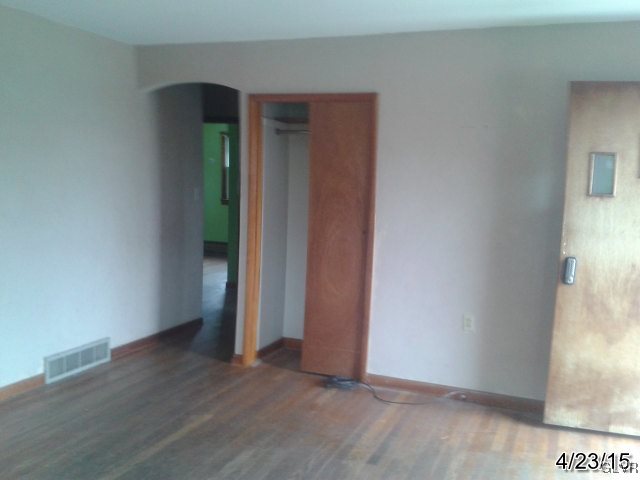521 Cherry Hill Road Nazareth, PA 18064 - Photo 9 of 21 an empty room with wooden floor and windows