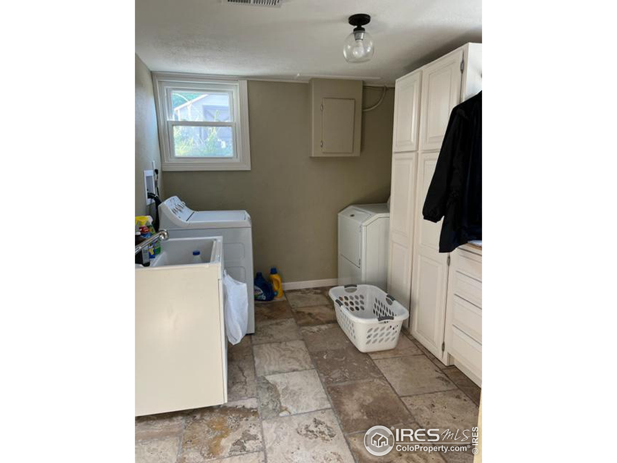1124 West 7th Street Wray, CO 80758 - Photo 11 of 11 a bathroom with a toilet and a mirror