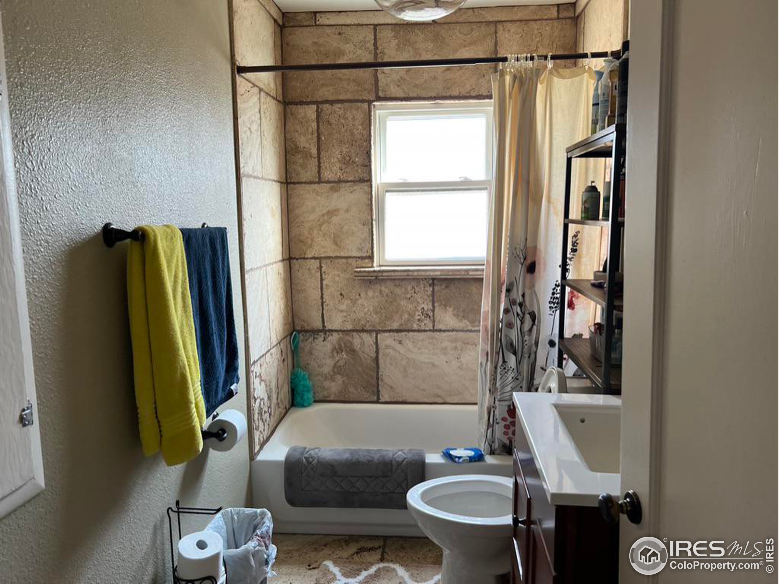 1124 West 7th Street Wray, CO 80758 - Photo 5 of 11 a bathroom with a sink and a mirror