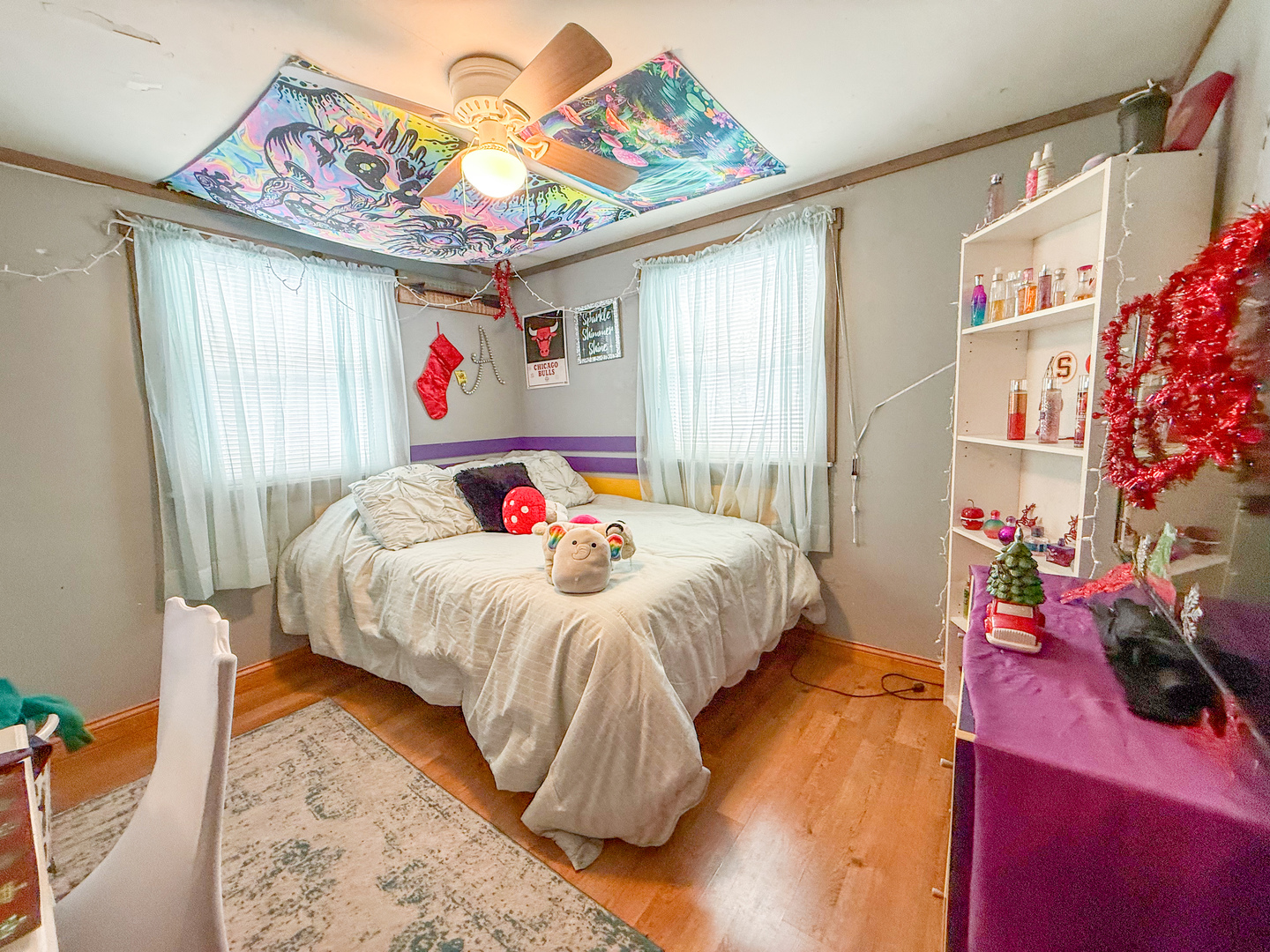 615 West 9th Street Sterling, IL 61081 - Photo 15 of 30 a bedroom with a bed and a chandelier