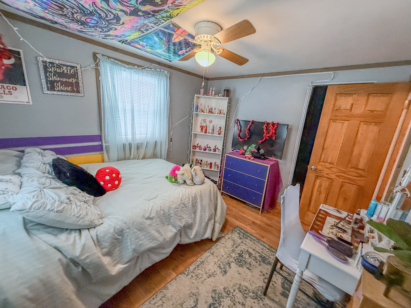 615 West 9th Street Sterling, IL 61081 - Photo 16 of 30 a bedroom with a bed and wooden floor