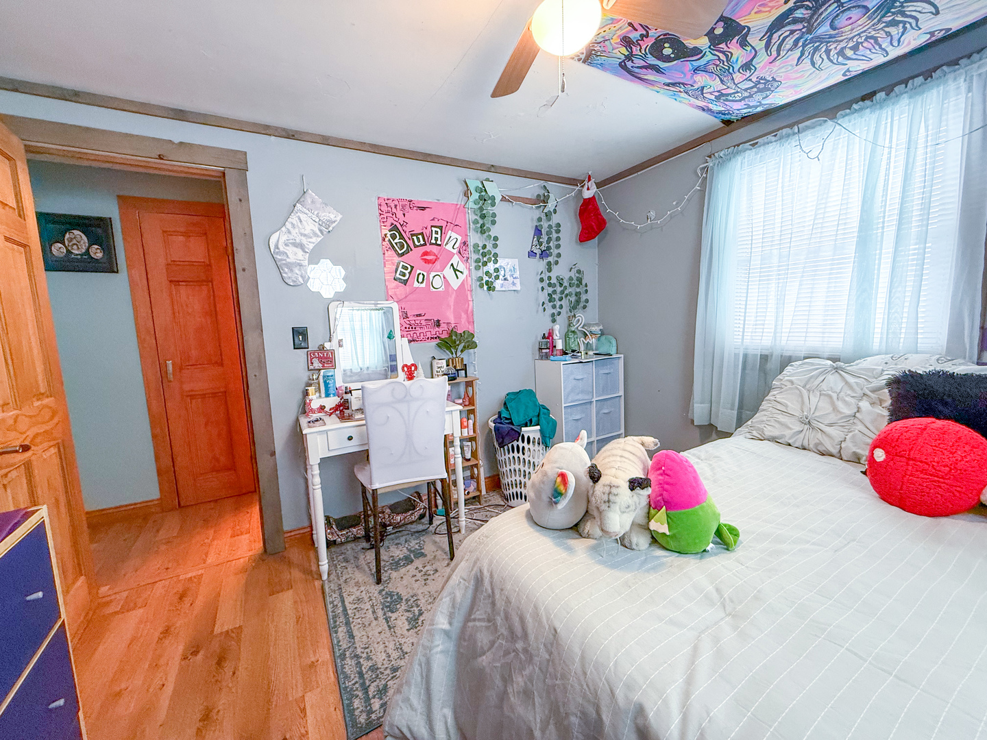 615 West 9th Street Sterling, IL 61081 - Photo 17 of 30 a bedroom with a bed and a chandelier