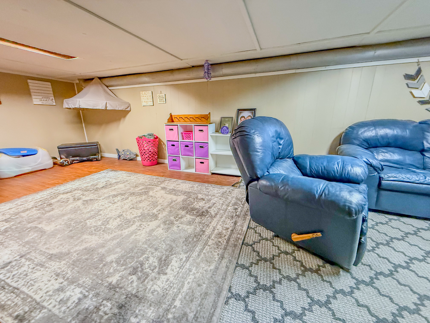 615 West 9th Street Sterling, IL 61081 - Photo 20 of 30 a living room with furniture and a air conditioner vent