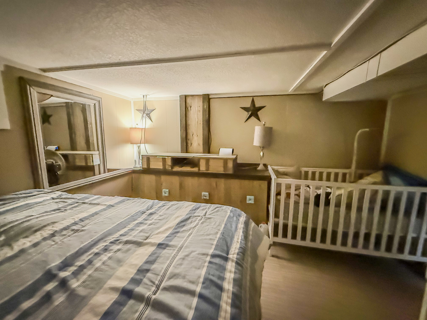 615 West 9th Street Sterling, IL 61081 - Photo 25 of 30 a spacious bedroom with a bed and a large window