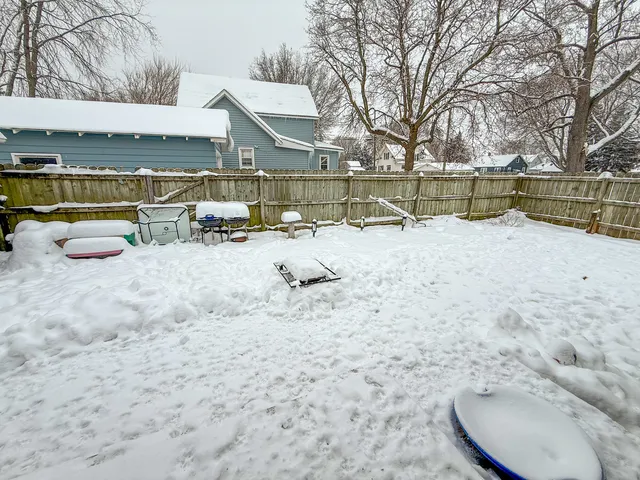a view of swimming pool with a lounge chairs