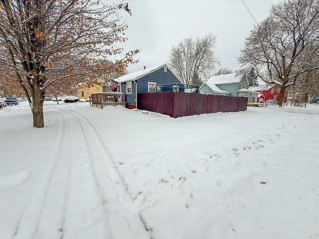 a view of road with large trees