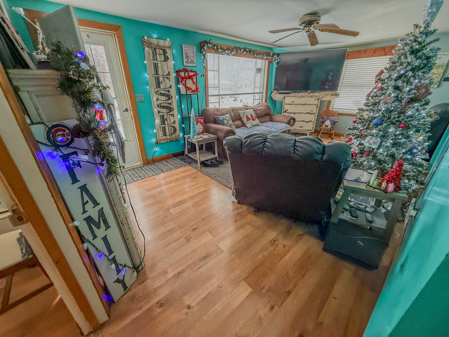 615 West 9th Street Sterling, IL 61081 - Photo 6 of 30 a bedroom with furniture and a flat screen tv