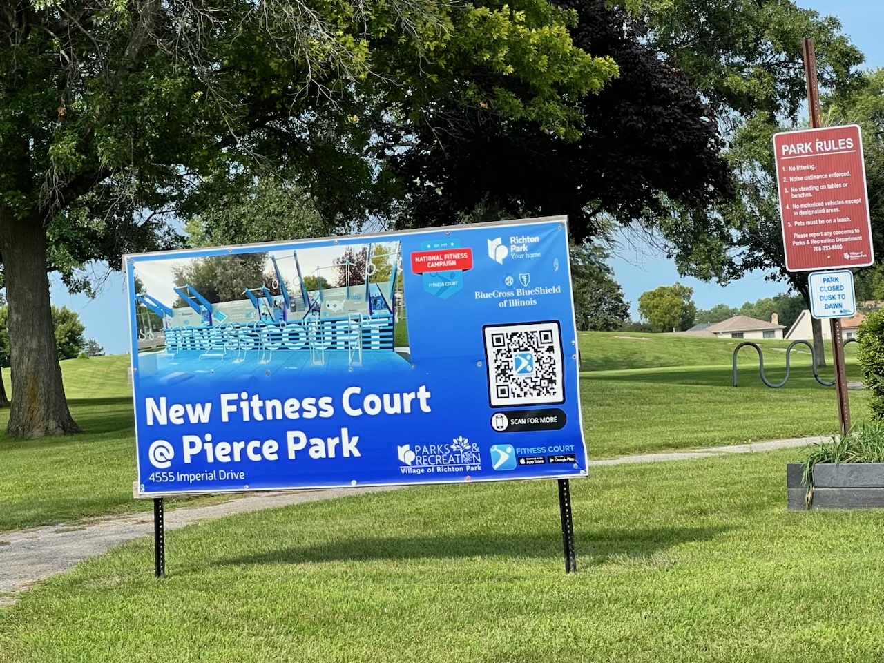 4552 Heartland Drive, Unit 3W Richton Park, IL 60471 - Photo 6 of 7 a view of outdoor space with a garden and signage
