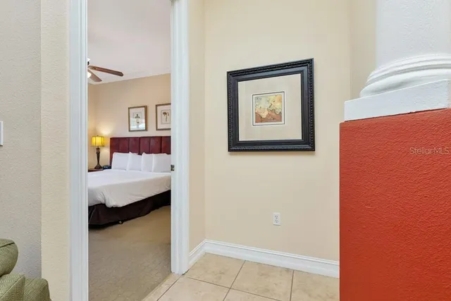 a bedroom with a bed and a view of bathroom