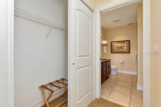 a view of a hallway with bathroom