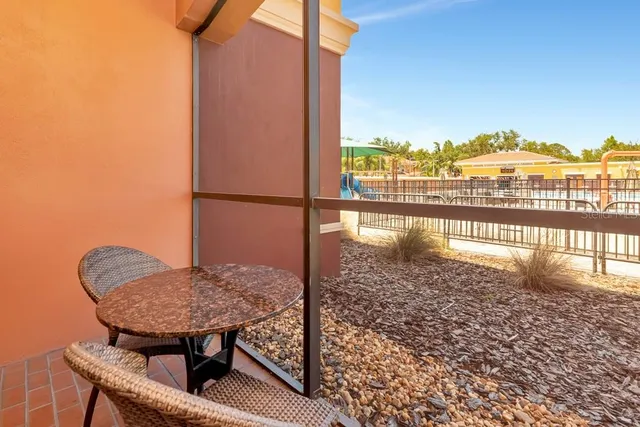 a view of swimming pool from a balcony