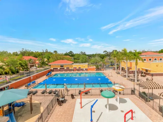 a view of swimming pool with an outdoor seating