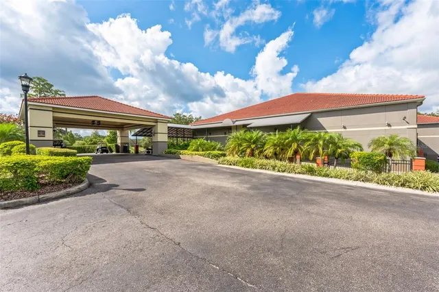 an aerial view of a golf course with a lake view