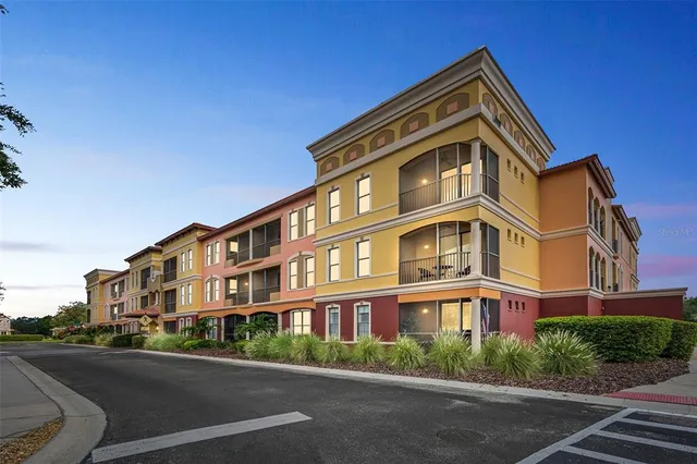 an aerial view of a swimming pool with a yard