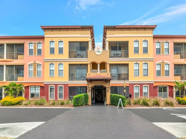 a view of a swimming pool with outdoor seating and plants