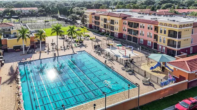 a view of an chairs and table in backyard
