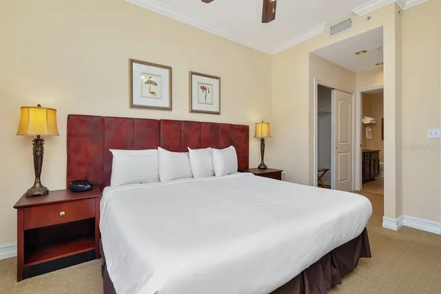 a bedroom with a bed and a night stand