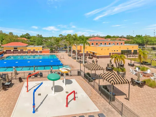 an outdoor space with patio swimming pool and ocean