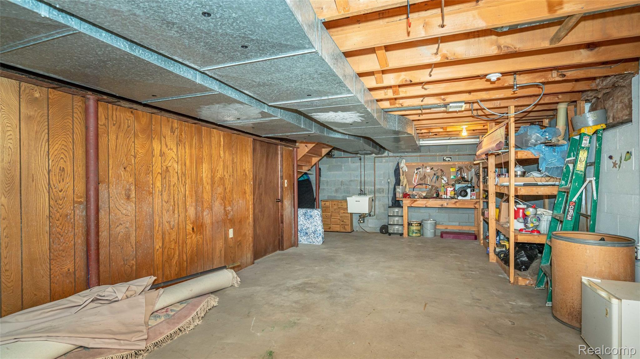 5330 Inverrary Lane Commerce Township, MI 48382 - Photo 76 of 76 Storage space and workbench.