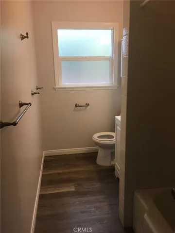 a bathroom with a toilet and a sink
