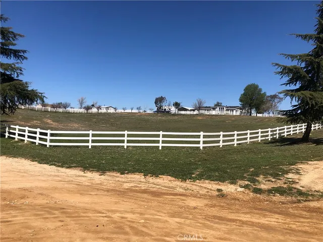 a view of a golf course with a lake view