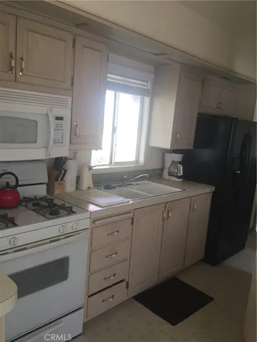 a white toilet sitting next to a window