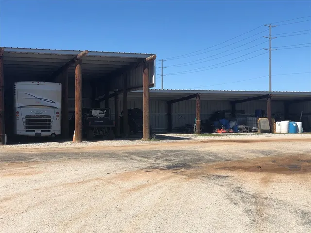 a view of a bathroom with a sink and a mirror