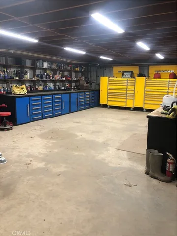 a view of kitchen with wooden cabinet