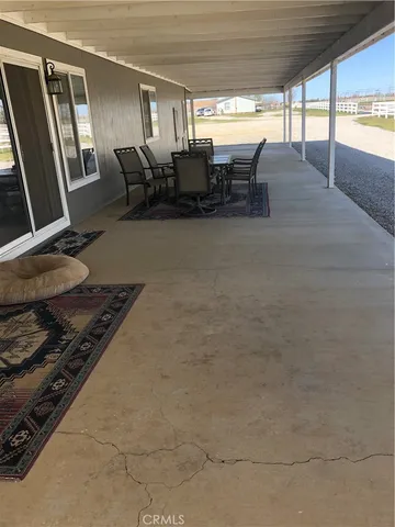 a kitchen with table and chairs