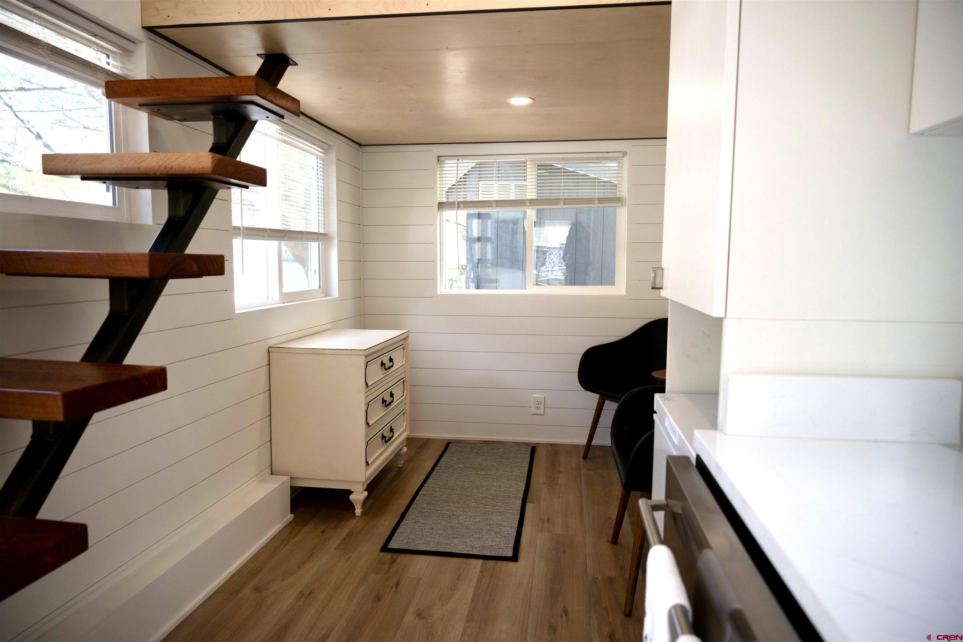 485 Florida Road, Unit C23 Durango, CO 81301 - Photo 13 of 22 a view of a hallway with wooden floor and staircase