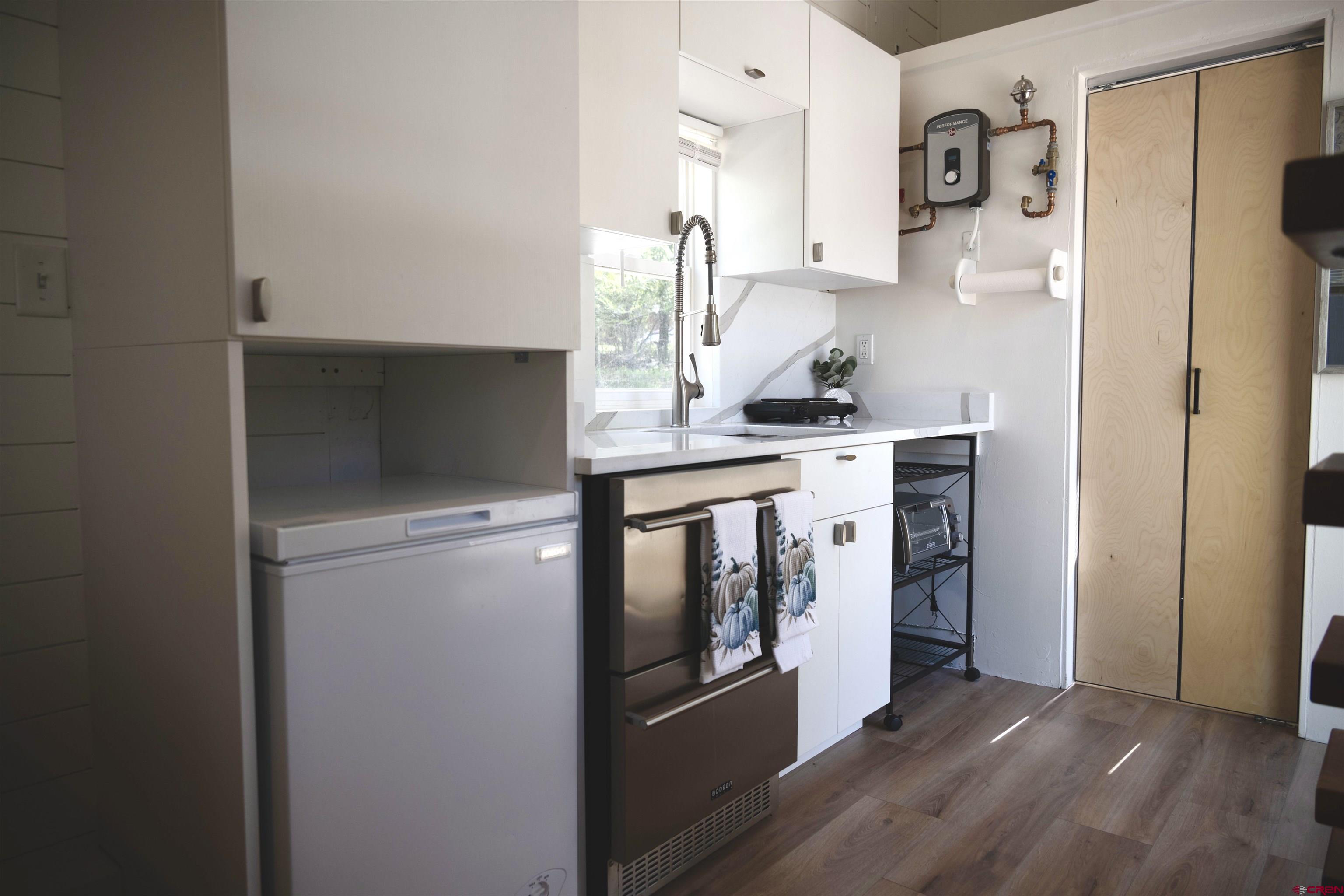 485 Florida Road, Unit C23 Durango, CO 81301 - Photo 8 of 22 a kitchen with stainless steel appliances a stove and a refrigerator