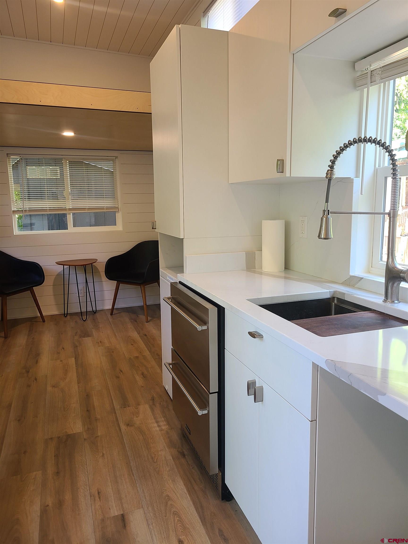 485 Florida Road, Unit C23 Durango, CO 81301 - Photo 9 of 22 a kitchen with stainless steel appliances granite countertop a sink a stove and a wooden floors