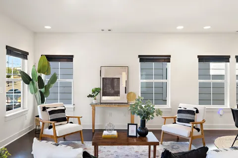 an aerial view of residential building with parking