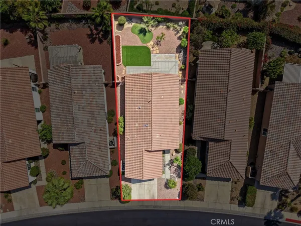 aerial view of a house with a tree