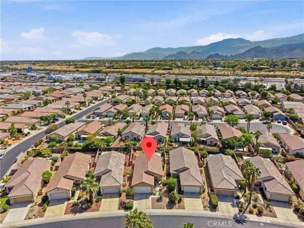 an aerial view of residential building and lake