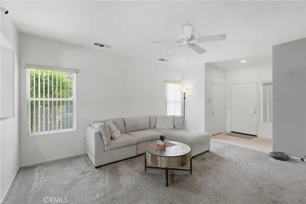 a living room with furniture and a window