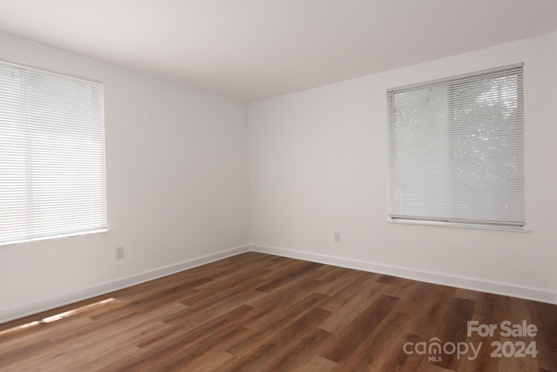 7516 Pebblestone Drive, Unit E Charlotte, NC 28212 - Photo 14 of 21 an empty room with a window
